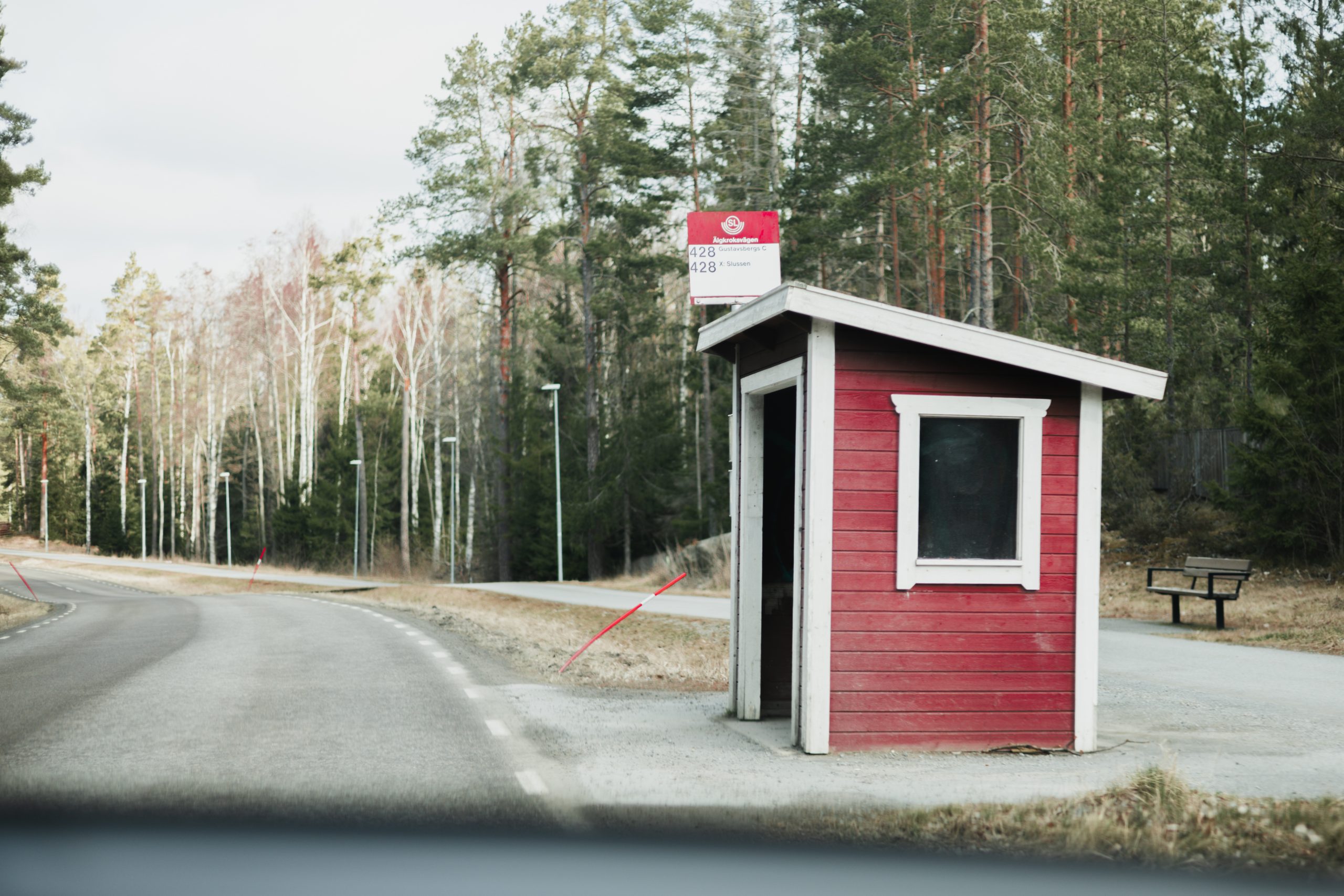 A red Nordic bus shelter